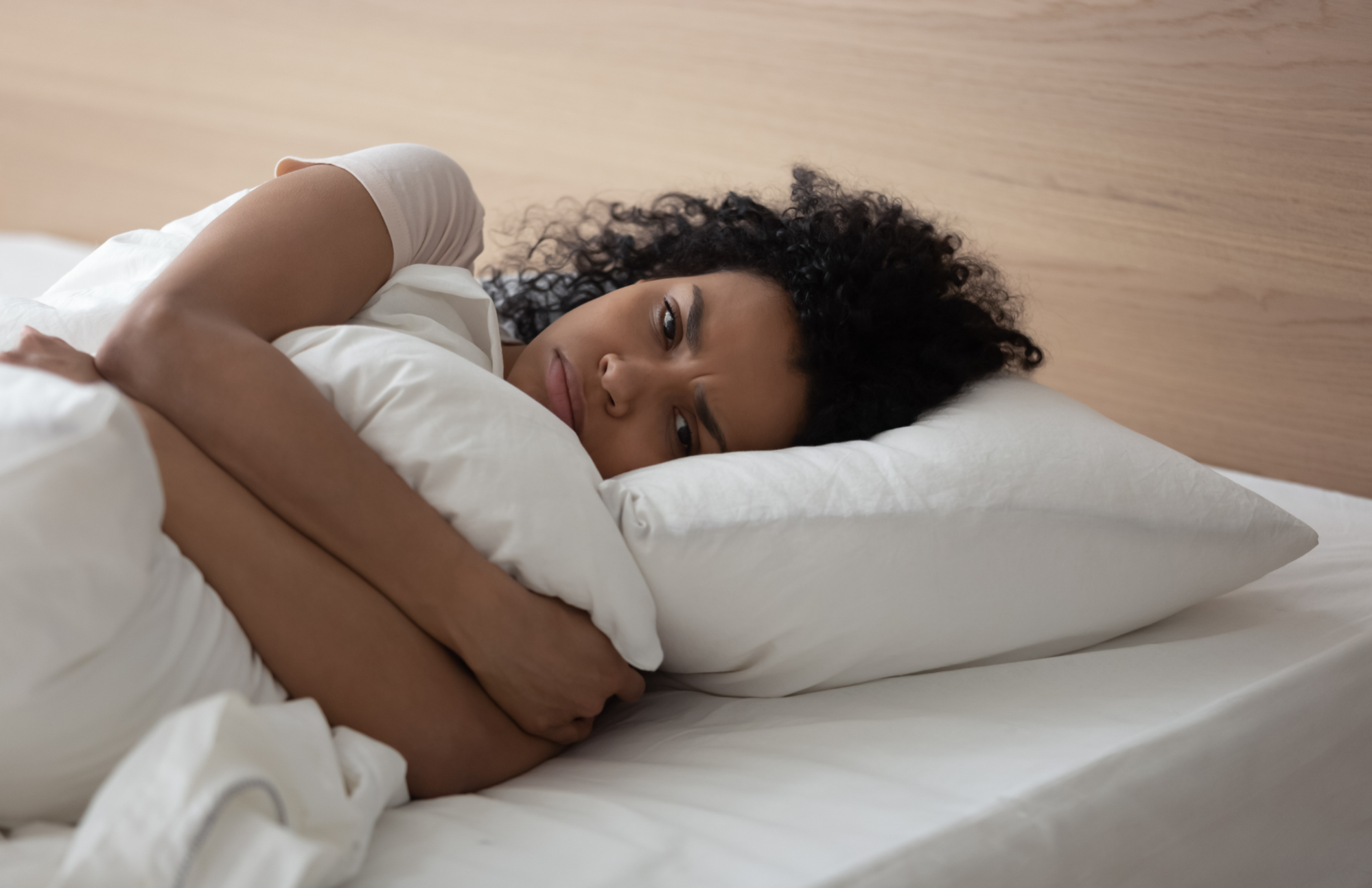 Woman anxious in bed. How to break the cycle of morning anxiety